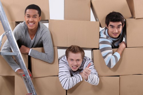 Moving professionals reviewing public liability insurance and safety procedures