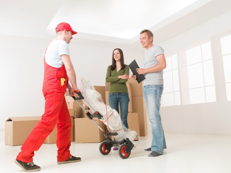 Local team loading bulky furniture for removal
