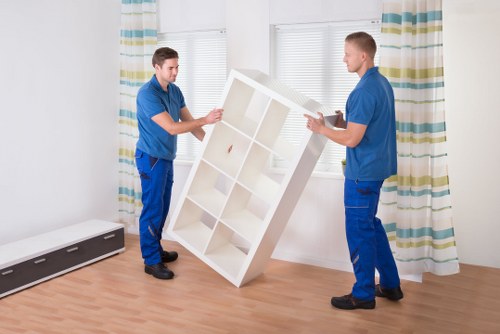 Supervisor reviewing safety steps with movers at a worksite