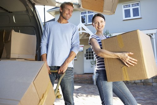 Protected sofas and household furniture prepared for transport in central London