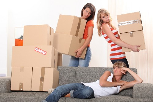 Local moving team organizing boxes for a Waterloo apartment